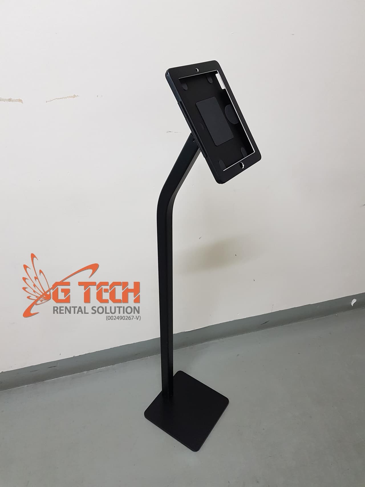 Black iPad floor stand holding an iPad in portrait orientation